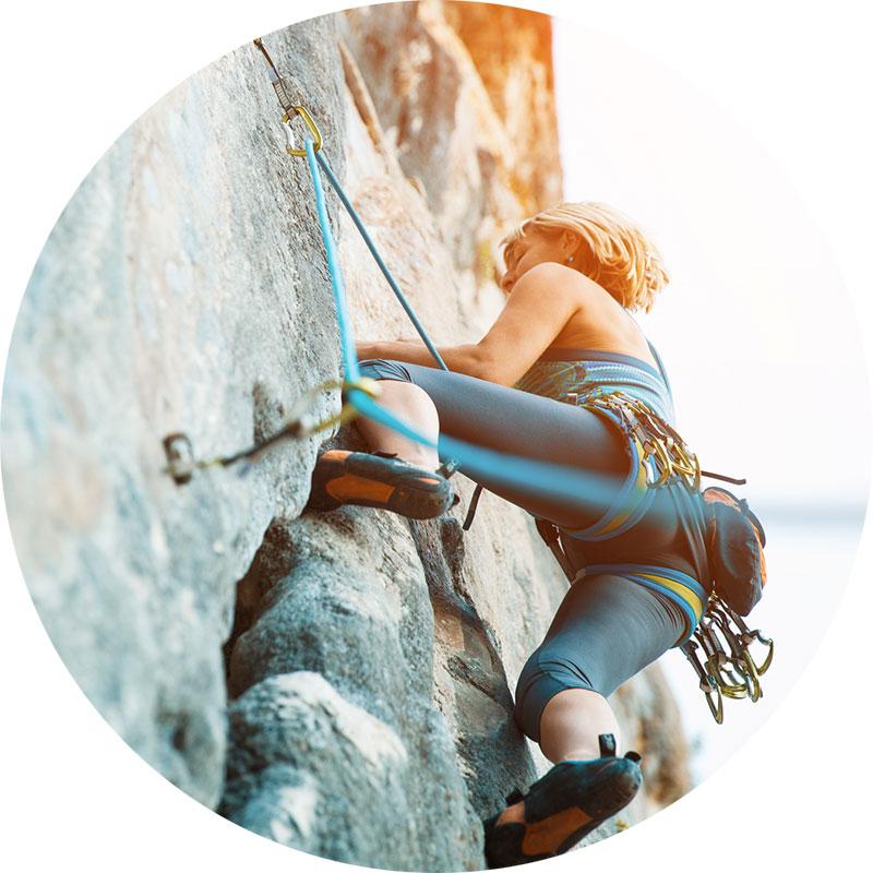 Define Risk image, woman climbing